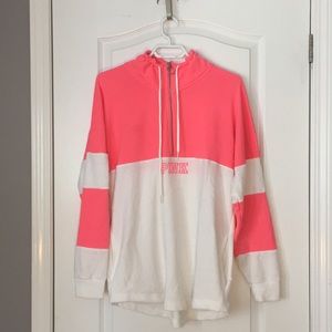 A Pink Victoria Secret quarter zip sweater